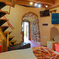 Entrance of the trullo with the sofa open